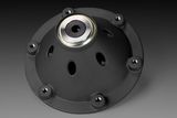 Top view of a mechanical component with a central bearing and multiple mounting holes.