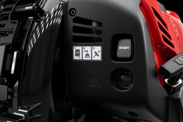 Close-up view of a product with a start button and instructional icons on its panel.