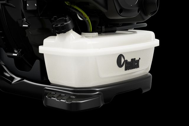 Side view of a fuel tank attached to a machinery component.