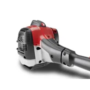 Close-up of a power tool engine with a vented cover and ergonomic handle.