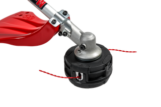 Close-up view of a trimmer head with red trimmer line.